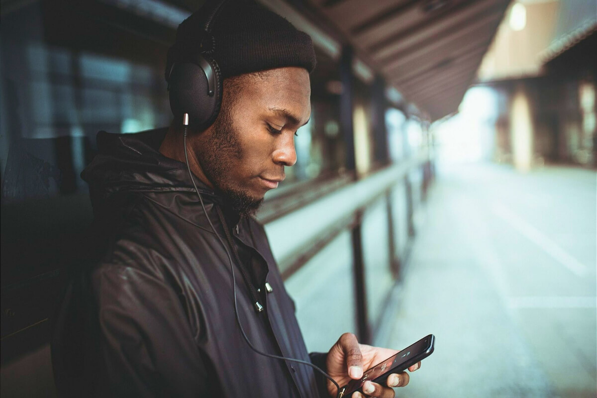 Man is listening to Moby with his smartphone