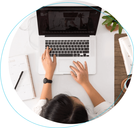 Woman using laptop at her desk