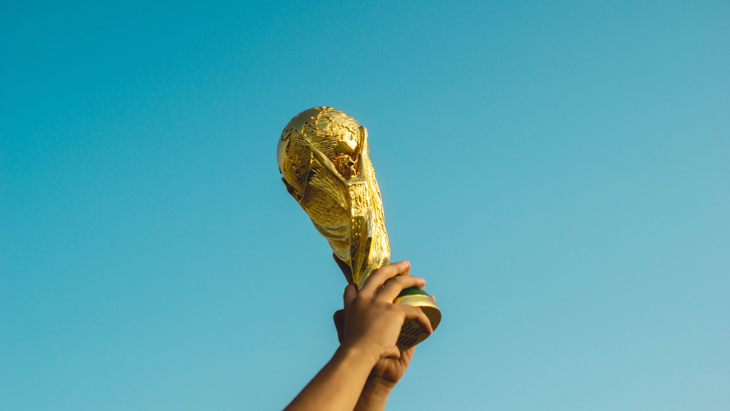 Person holding up a trophy