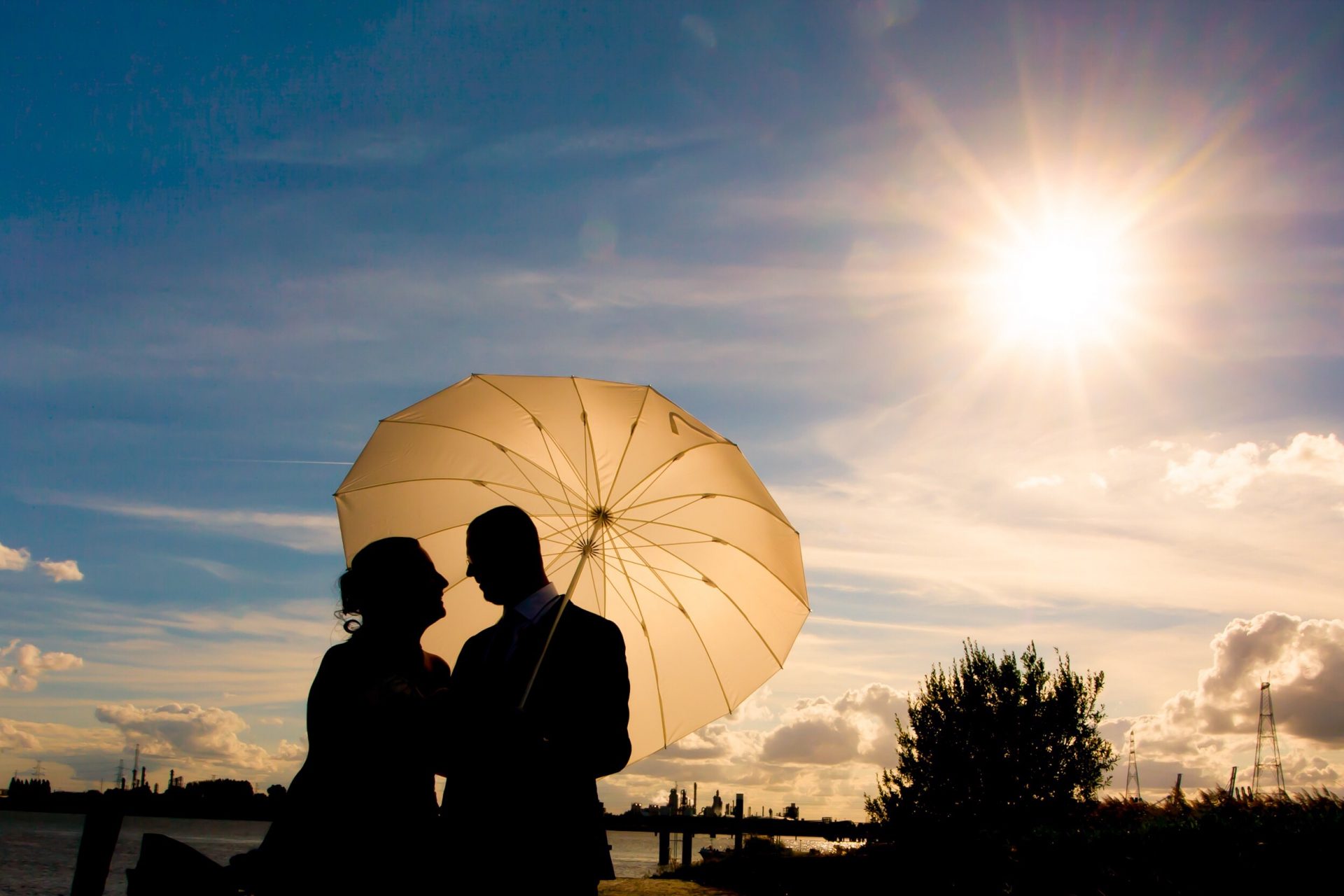 couple together under an umbrella