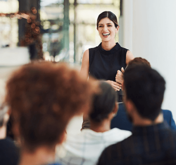 Woman speaking to a group of people