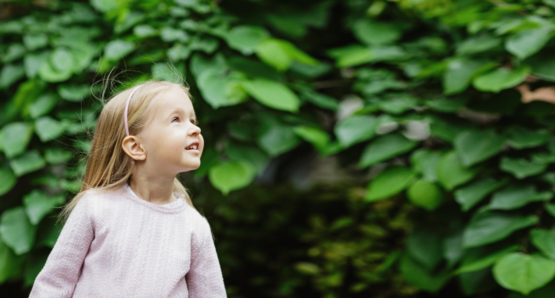 Young girl smiling outside