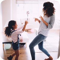 Mother and daughter playing at home
