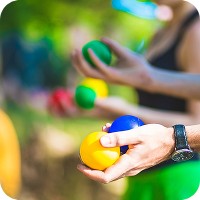People holding colorful balls