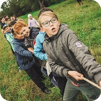 Kids playing tug of war outside