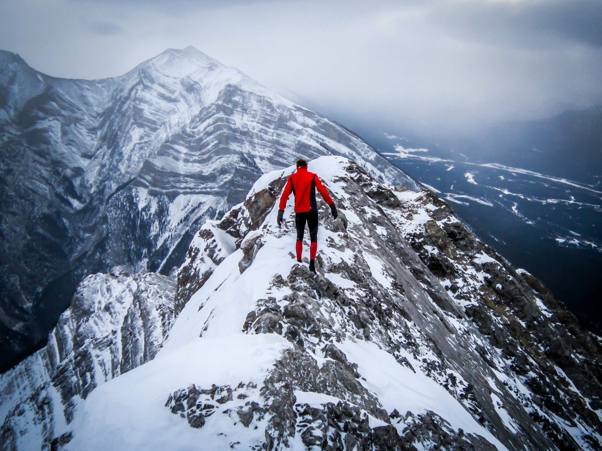 Man at the top of a mountain