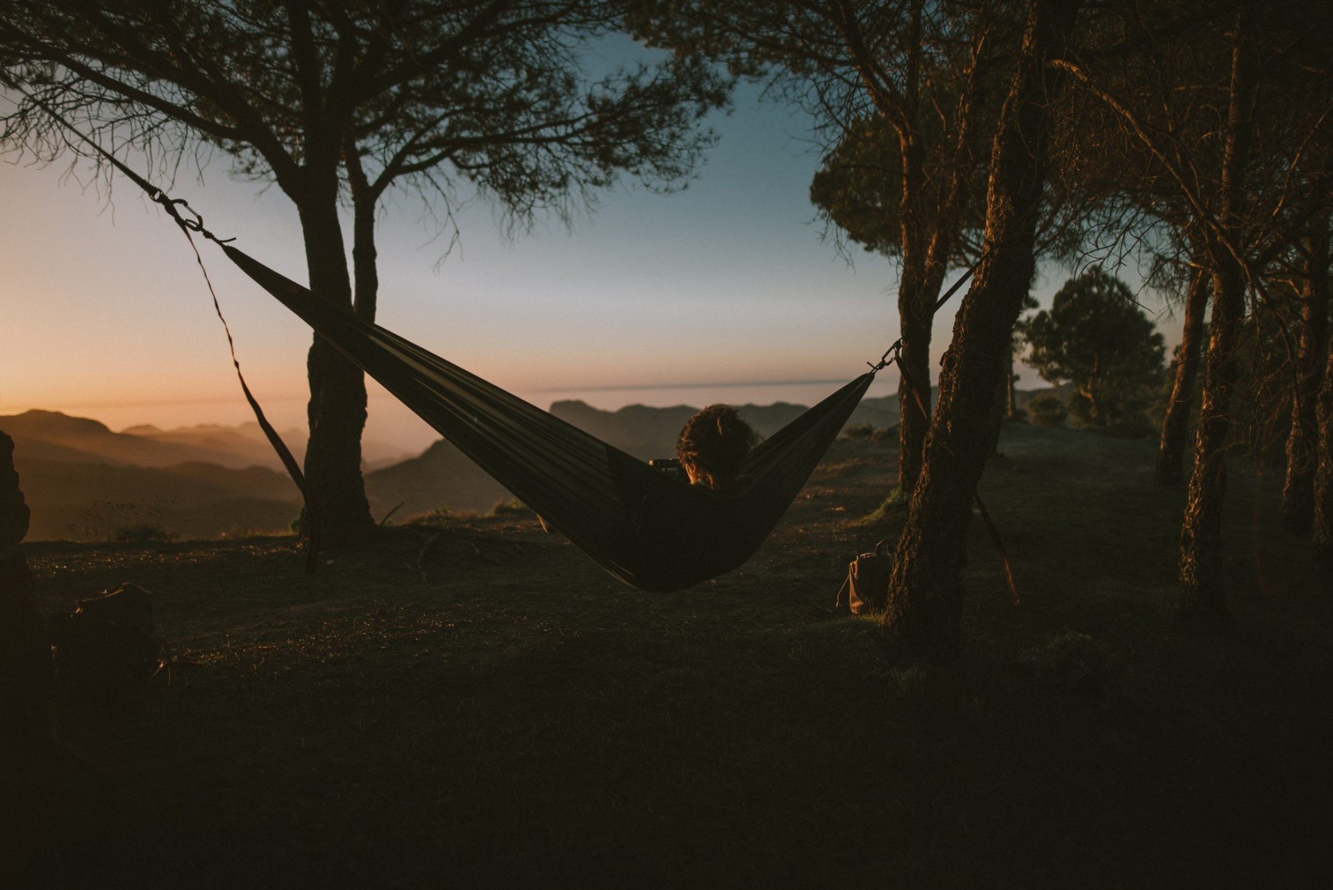 Woman in a hammock in the forest