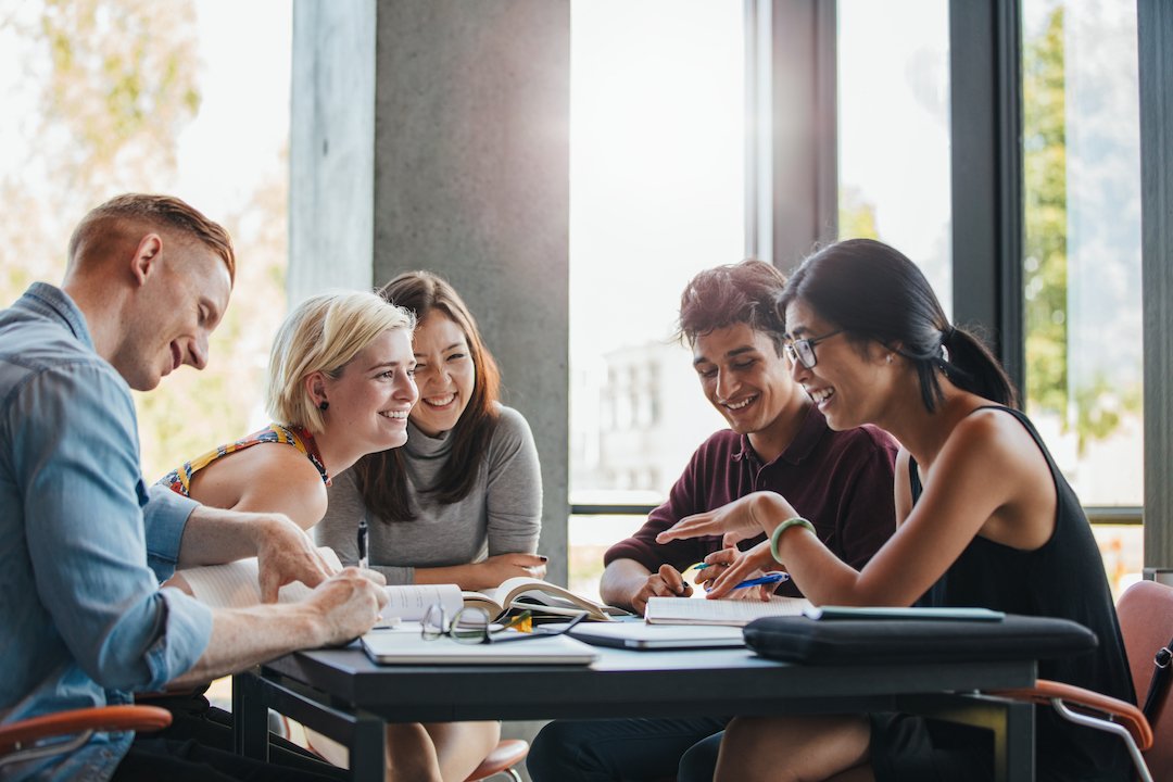 employees working as a group and laughing