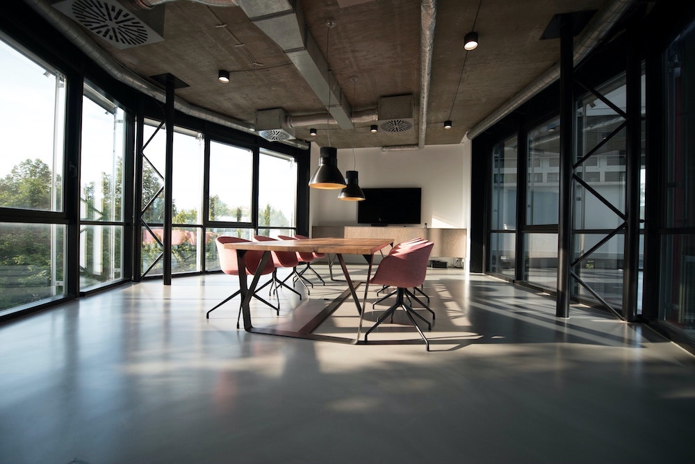 Table surrounded by walls of windows