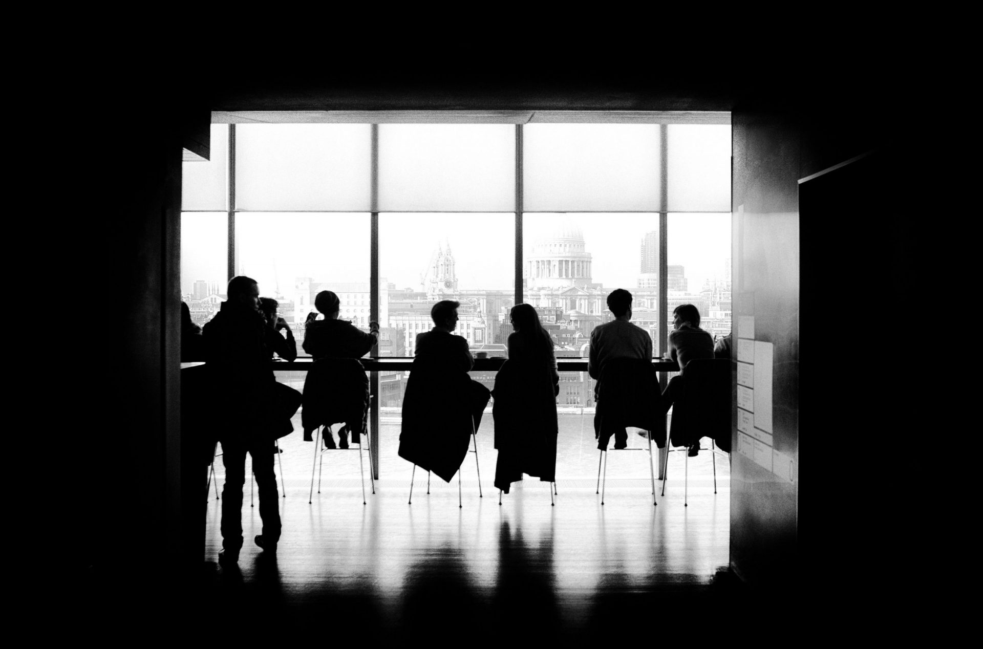 silhouette of people sitting at a cafe