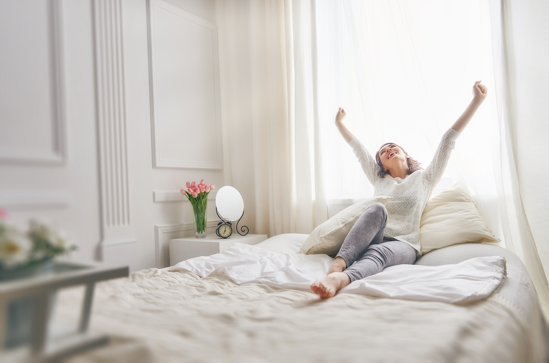 woman stretching on the bed