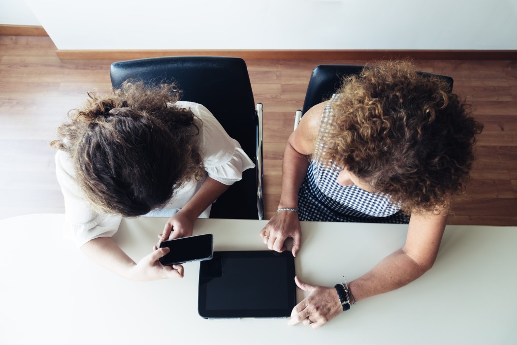 two businesswomen working together at office