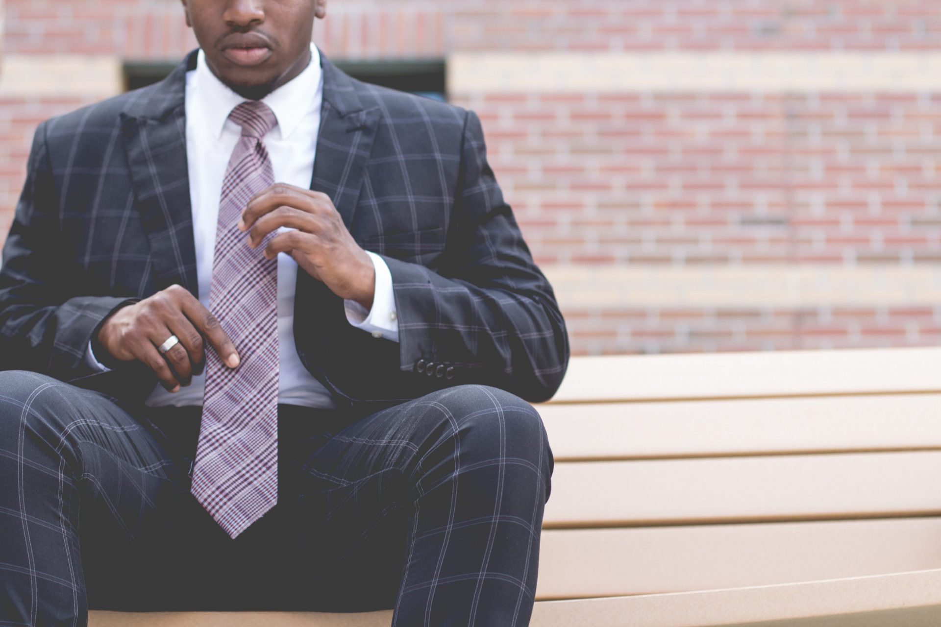 African American man fixing his tie