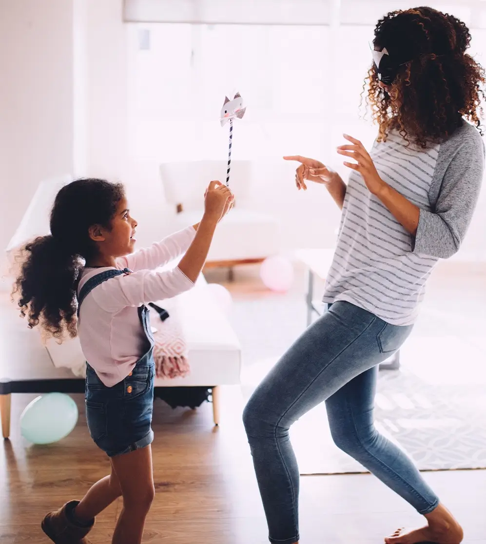 Mother and daughter playing at home