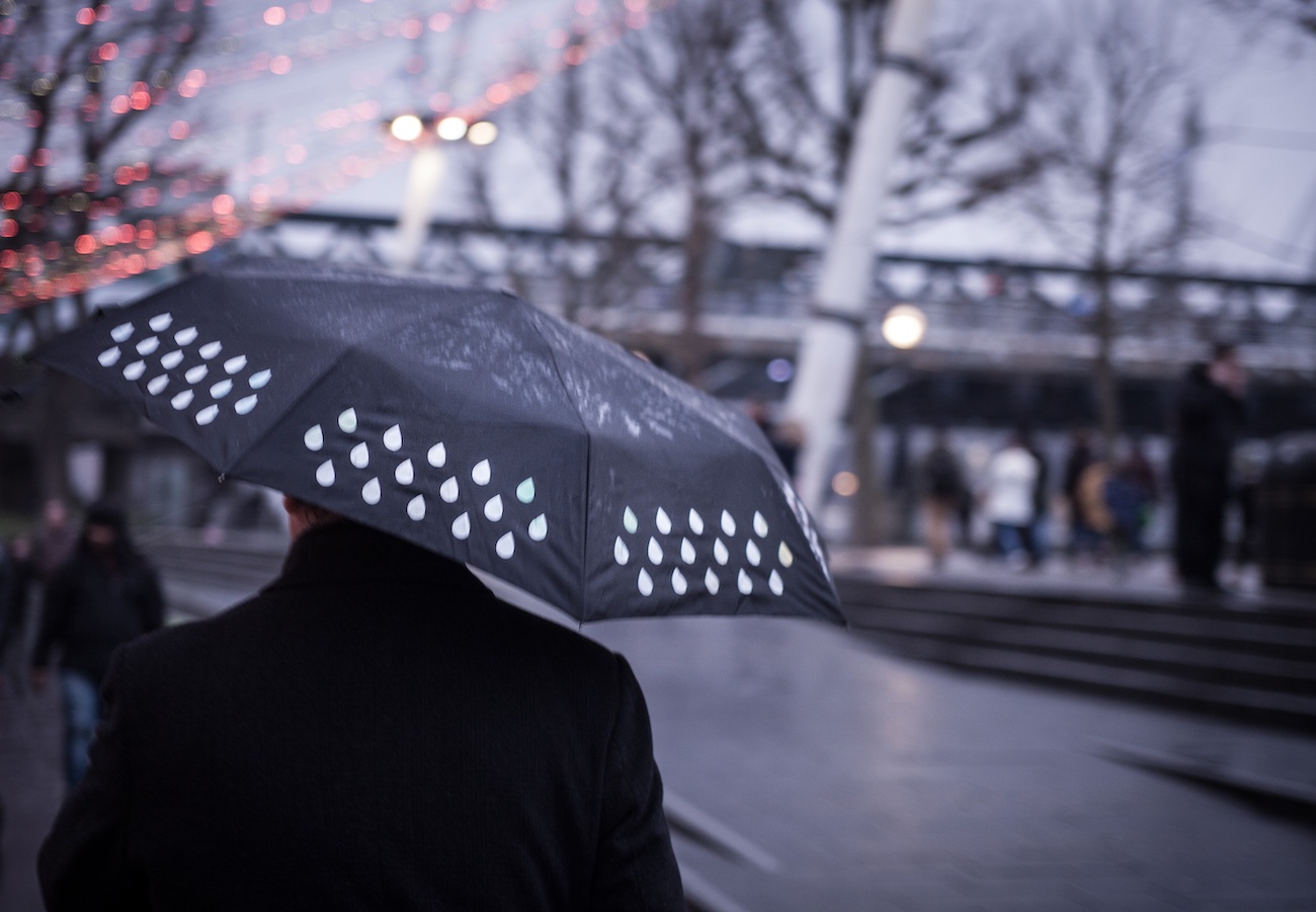 Man holding an umbrella