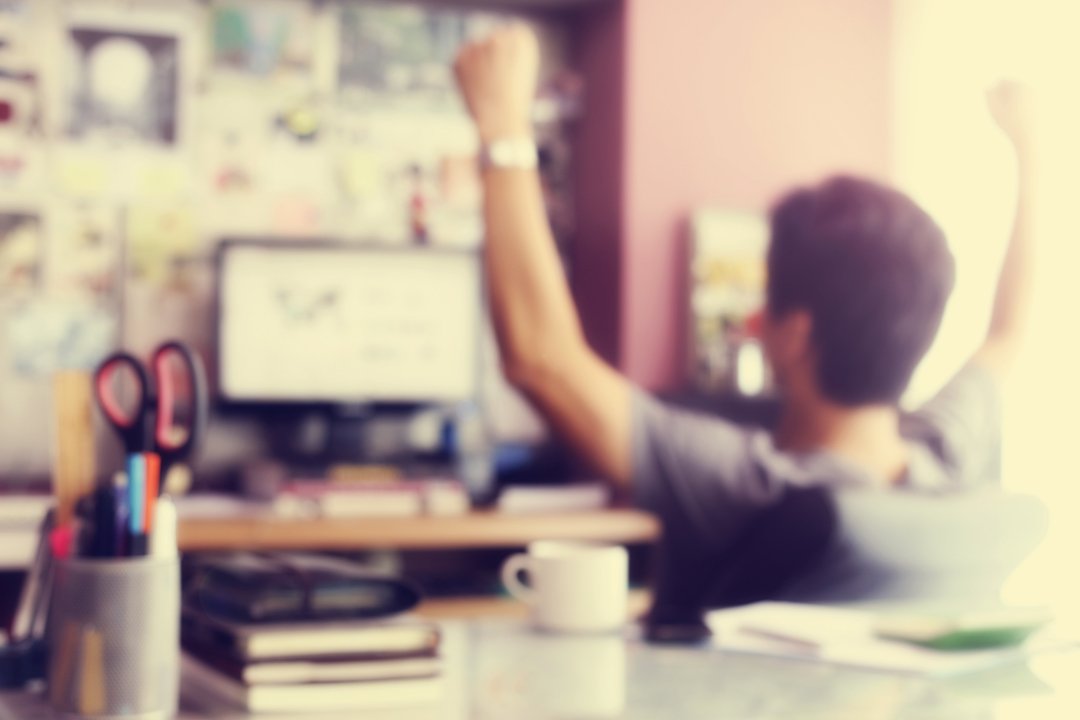 Employee working from home stretching arms