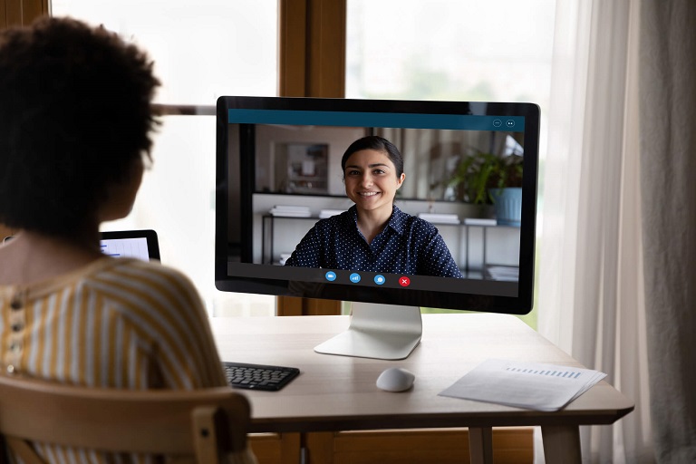 African American mother having video call meeting with Indian BCBA