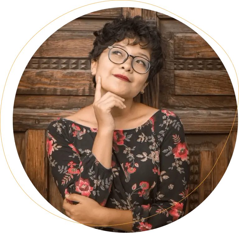 Hispanic woman thinking in front of large wooden door