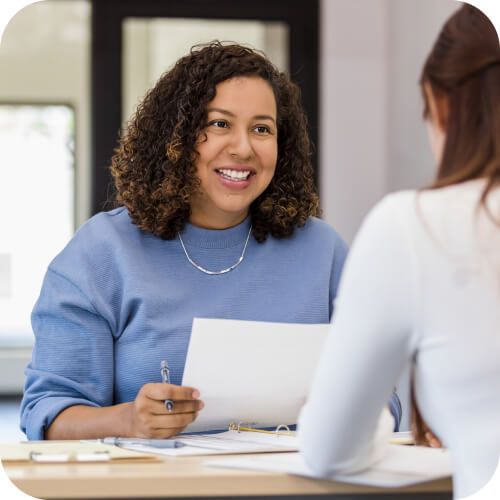 Smiling HR person conducting interview with potential employee