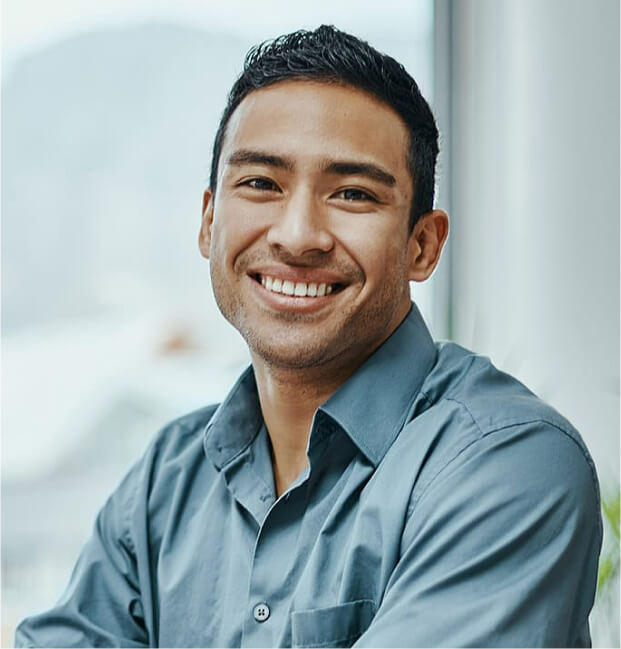 Shot of a young businessman using a laptop in a modern office