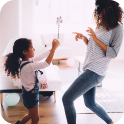 Mother and daughter playing at home