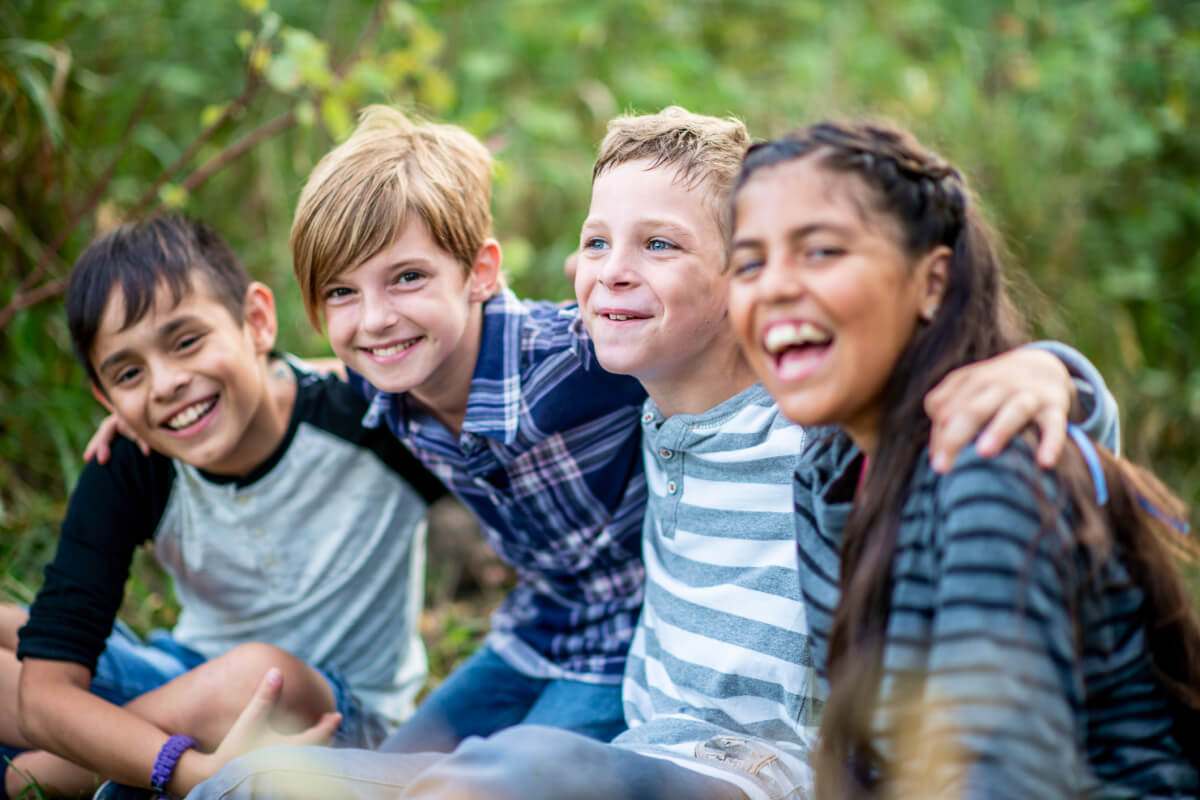 Diverse group of friends in forest building healthy relationships